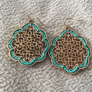 Teal and gold colored earrings